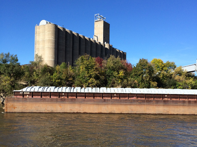 An empty barge sits docked at a river terminal on the Mississippi River west of downtown St. Paul, Minnesota. As harvest progresses and barges are loaded to head south, they will face low-water obstacles and lock repairs along their journey. The river level at St. Paul was at 5 feet above zero gauge on Oct. 2. (DTN photo by Mary Kennedy)
